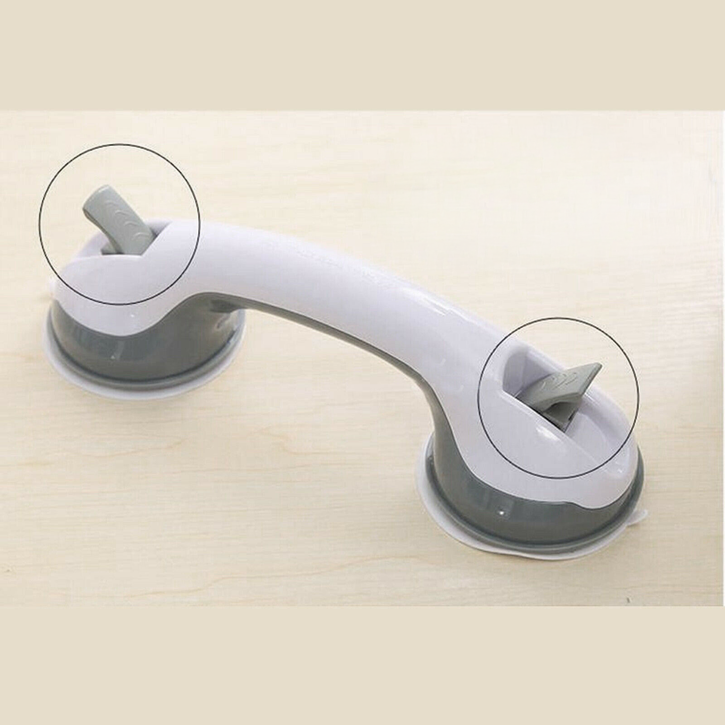 Close-up of lock levers on a 16-inch suction grab bar with suction cups, on a beige background